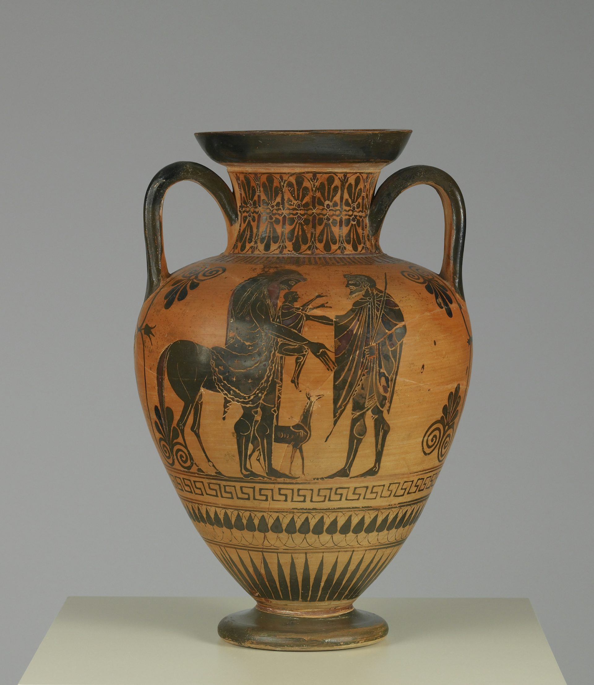 Chiron (left) receiving the infant Achilles (center) from Peleus (right).